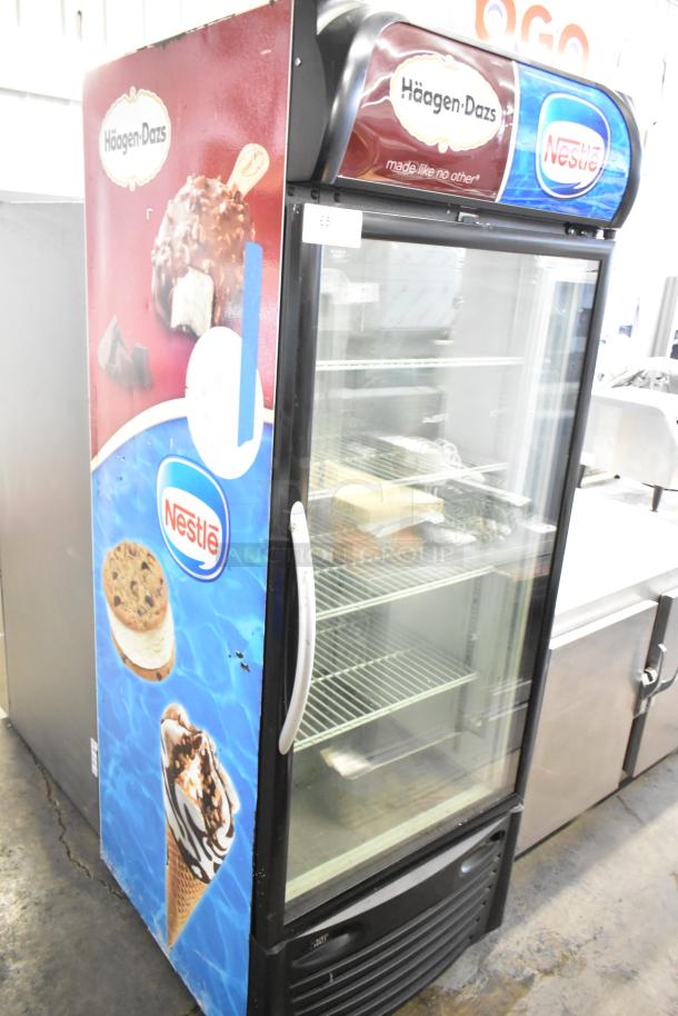Minus Forty 22-USGF-X1-1C003-BK-NESTLE commercial freezer, single-door, branded with Häagen-Dazs and Nestlé logos, 115V, used condition.