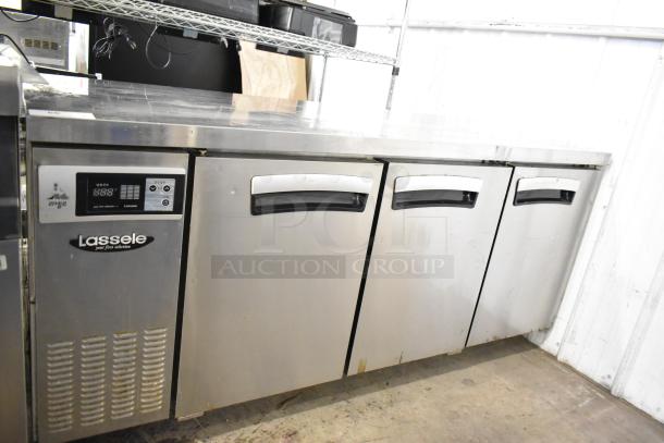 Lassele LT-1833R commercial 3-door undercounter cooler, 115V, stainless steel, digital controls, moderate wear.