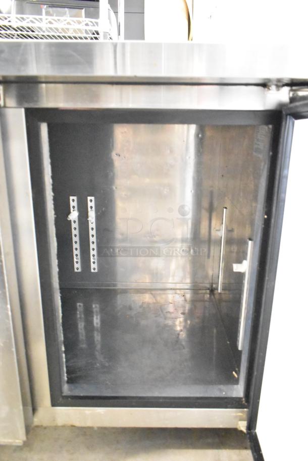 Lassele LT-1833R Commercial 3 Door Undercounter Cooler, stainless steel, open door view, model tag visible inside.