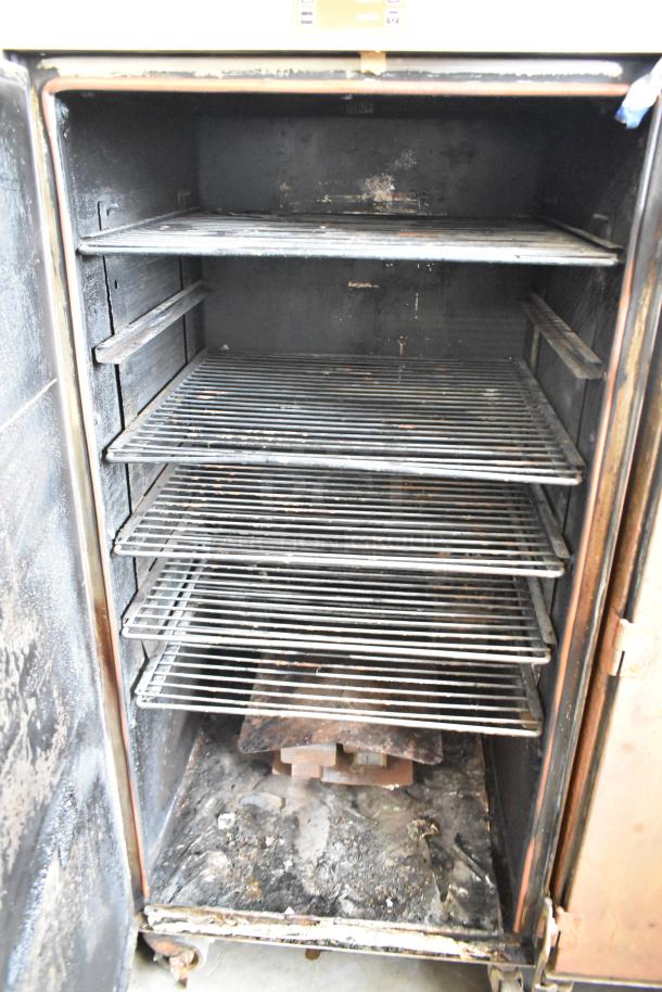 Cookshack 250 Commercial Electric Smoker, six racks, visible wear, on commercial casters; 208V, 1 Phase.