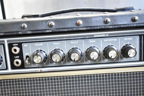 Roland Jazz Chorus 120 Speaker, control panel close-up, includes volume, treble, middle, bass, distortion, reverb knobs. Condition: used.