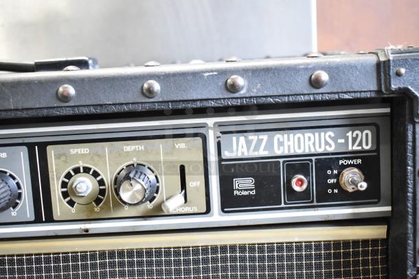Roland Jazz Chorus 120 speaker, black casing with control knobs for speed and depth, visible "JAZZ CHORUS -120" label.