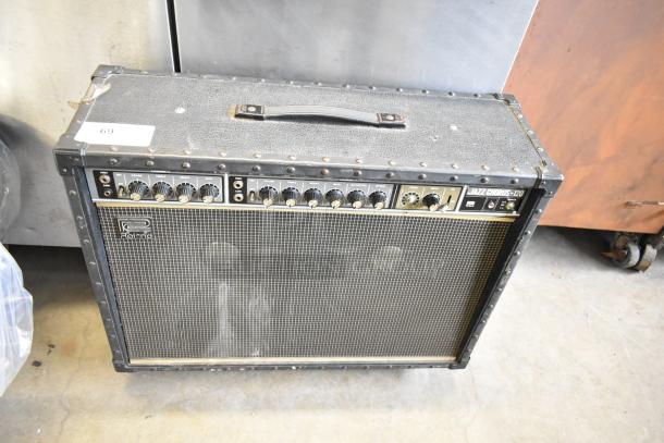 Roland Jazz Chorus 120 speaker on casters, features black finish, control panel with knobs, visible wear on top.