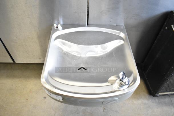 Brand new Elkay KM35-2 wall mount water fountain with minor scratches. Stainless steel finish, compact design.