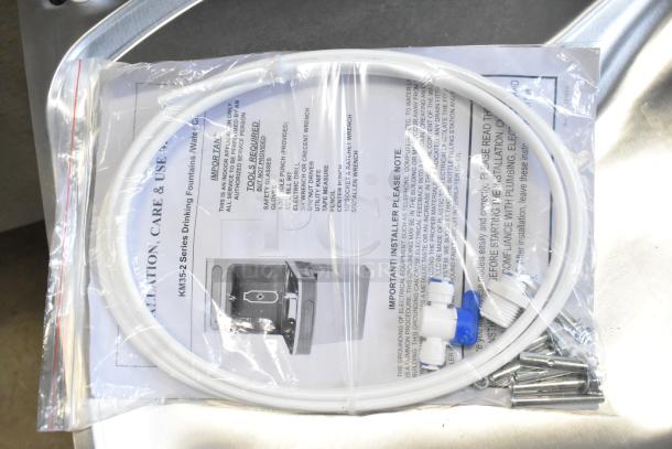 BRAND NEW Elkay KM35-2 wall mount water fountain with installation kit, shown with care and use manual in package.