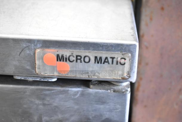 Micro Matic MDD-78 S kegerator logo on stainless steel surface, showing brand marking.