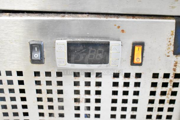 Micro Matic MDD-78 S kegerator control panel with temperature display and power switches, showing signs of use.