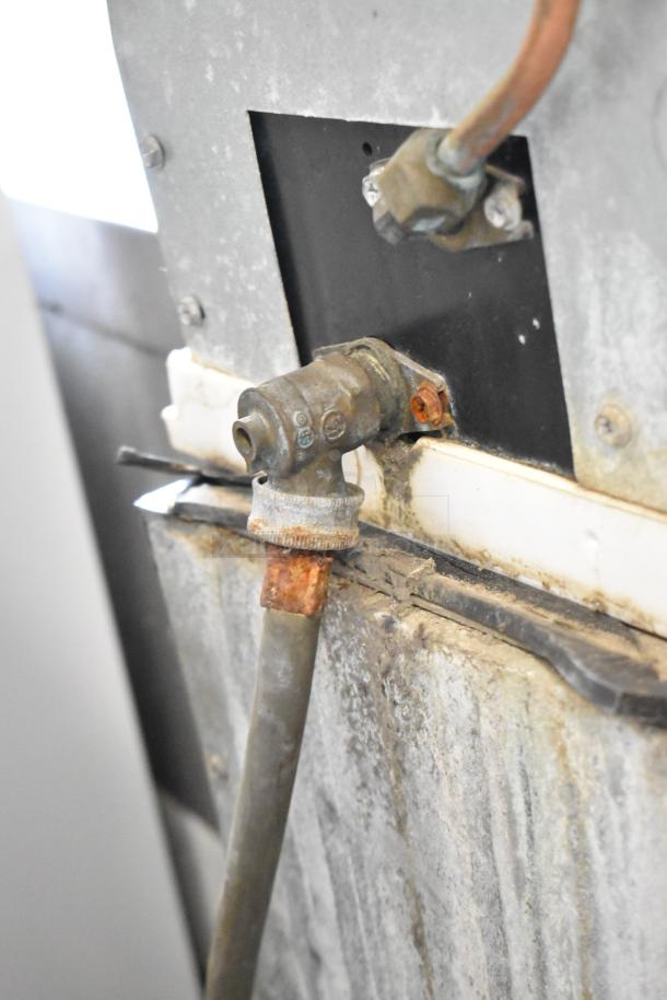 Manitowoc ID0452A-161 ice head on bin in used condition. Visible wear and rust on metal components. 115 volts, 1 phase.