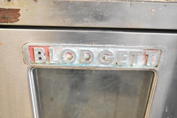 Blodgett Mark-V-111 convection oven, view-through door, thermostatic controls, 208-230V, 1 phase. Visible wear on exterior.