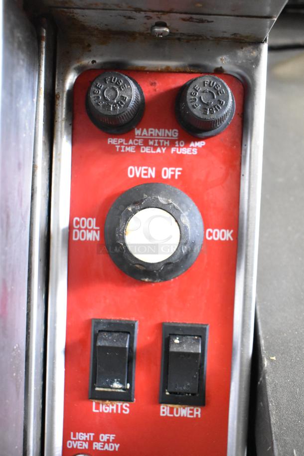 Blodgett Mark-V-111 convection oven control panel with cool down, cook, lights, and blower switches, and warning for 10 AMP fuses.