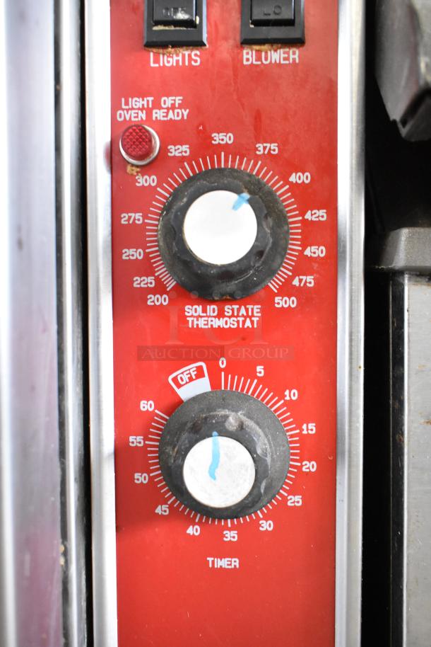 Blodgett Mark-V-111 convection oven control panel with solid-state thermostat and timer knobs, ready light, and blower switch.