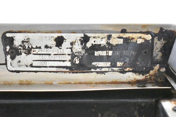 Blodgett Mark-V-111 label on commercial convection oven, showing model, voltage, and usage marks. 208-230 volts, 1 phase.