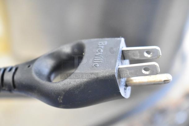 Breville BTA730XL/A toaster plug close-up, showcasing brand mark. 120V, 1 phase. Suitable for countertop use.