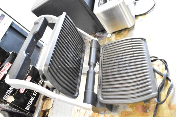 T-Fal OptiGrill countertop panini press, 115V, open position, black and silver, used condition with minimal wear.