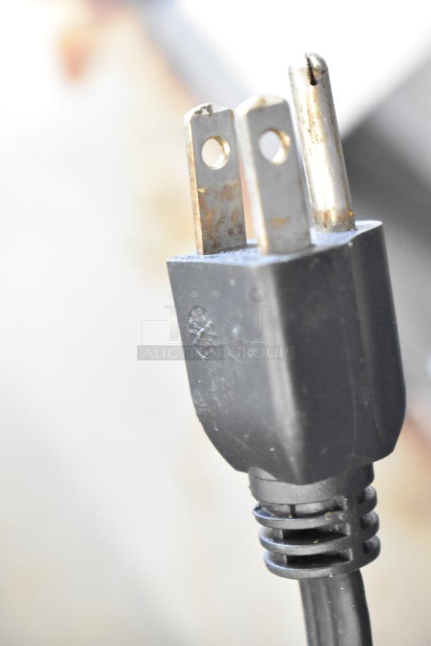 Close-up of the T-Fal OptiGrill Panini Press power plug, showing a 115-volt, 1-phase connection, indicating electric capability.