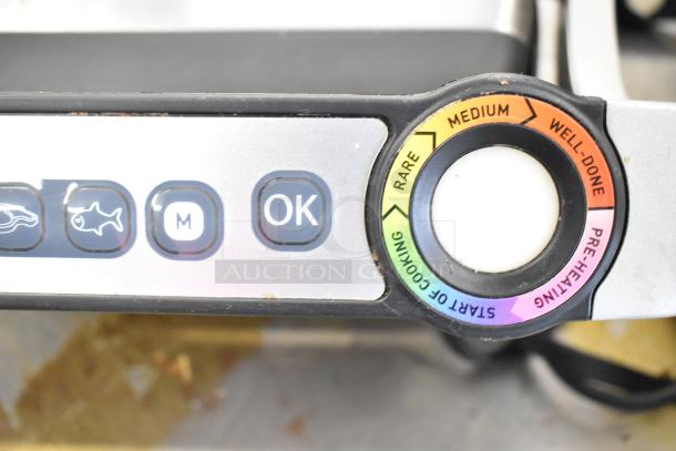 T-Fal OptiGrill Panini Press control panel displaying cooking settings with marked options for rare to well-done.
