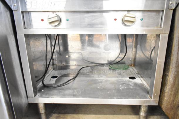 2021 ServIt 423EST2WOPB electric steam table, two-pan capacity, open well, 120 volts, 1 phase, used condition.