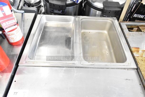 2021 ServIt 423EST2WOPB commercial electric steam table with two open wells. 120V, 1 phase, stainless steel, good condition.