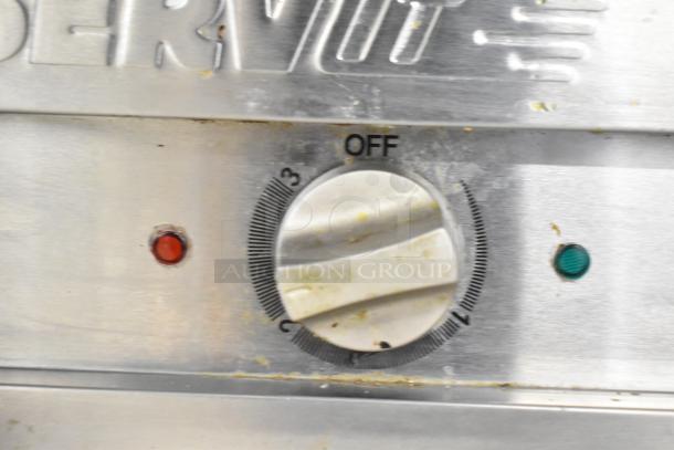 Dial controls of a 2021 ServIt 423EST2WOPB Commercial Electric Steam Table. Features red and green indicator lights.