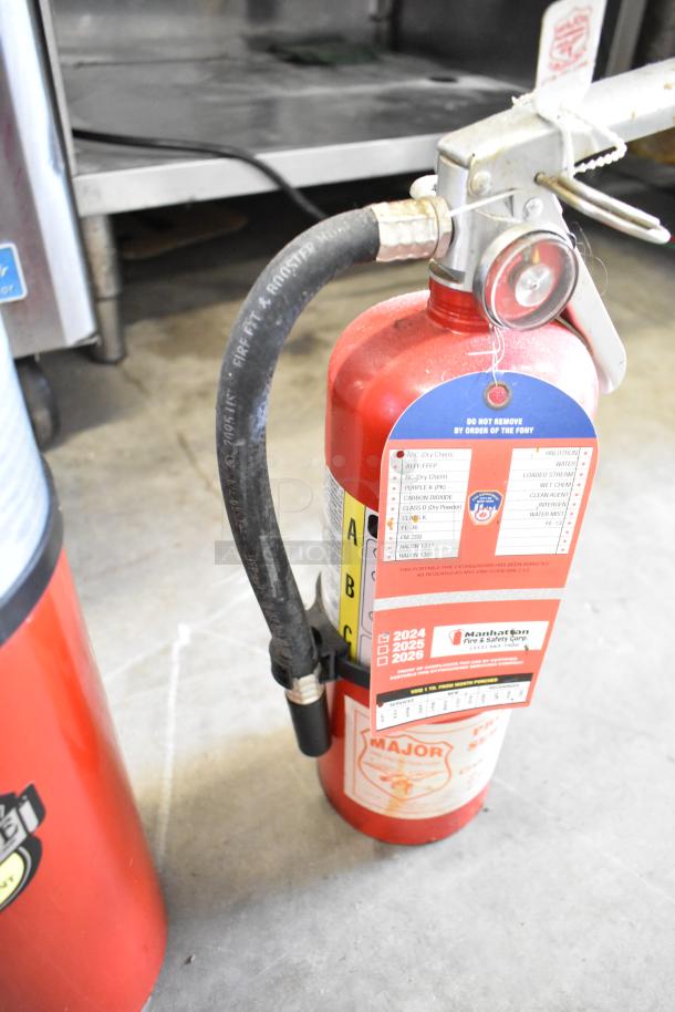 Two fire extinguishers, including Buckeye brand, with inspection tag valid through 2026. Pickup only, no shipping.