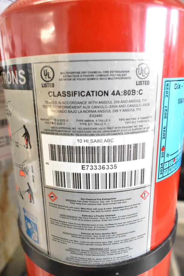 Red fire extinguisher featuring Buckeye brand, classification 4A:80B:C, with detailed safety instructions and barcode visible.