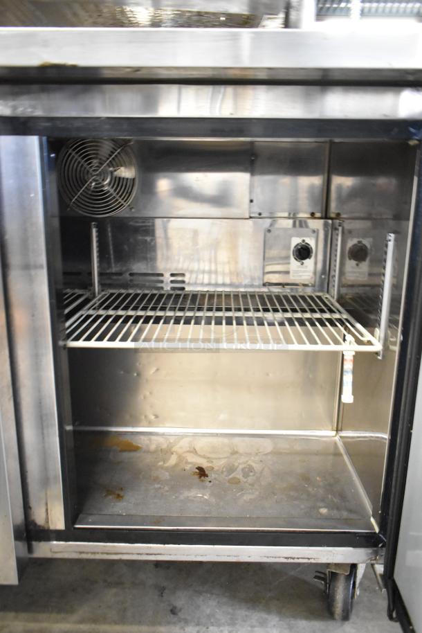 Turbo Air MUR-48 commercial 2-door undercounter cooler on casters, 115 volts, 1 phase, with interior fan and shelving.