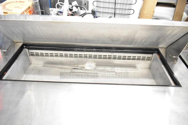 Dukers DSP48 commercial prep table with mega top, for sandwiches and salads. Features: 115V, 1-phase, on casters.