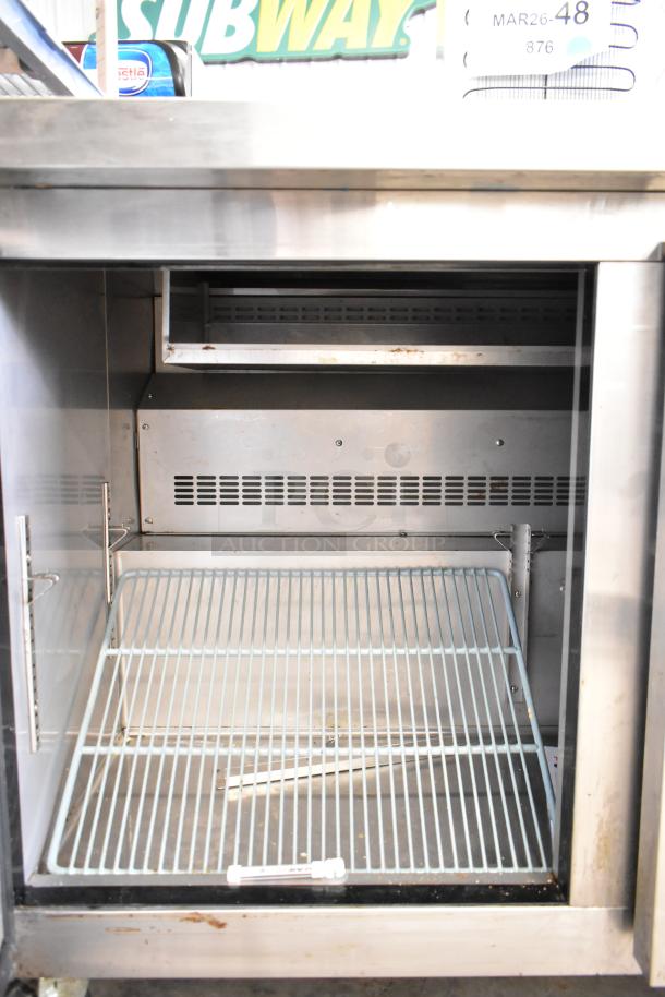 Dukers DSP48 commercial sandwich salad prep table with mega top, visible interior shelving, and stainless steel finish. 115V, 1 phase.