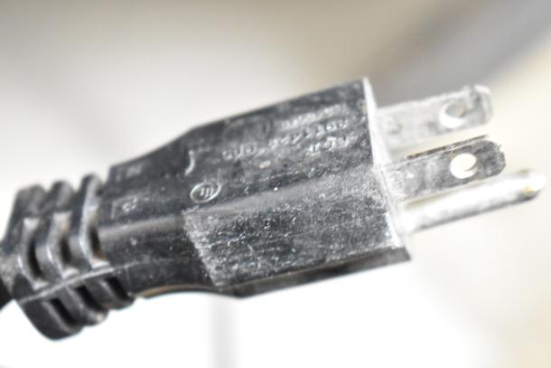 Black electrical plug for 2022 Manitowoc URF0310A-161B Commercial Ice Machine, showing voltage details.