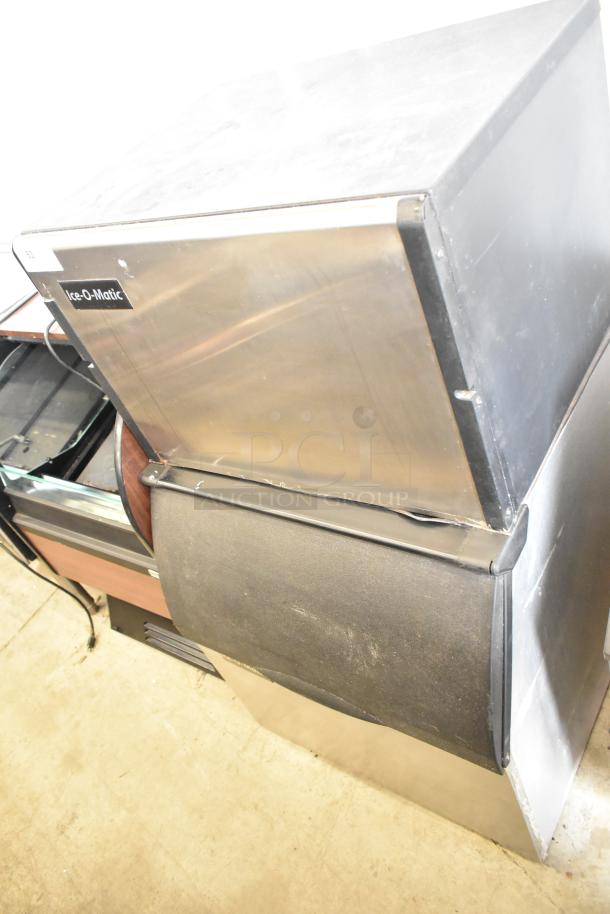 Ice-O-Matic ICE0400FW4 ice head on B40PSB bin, 115V, 1-phase. Stainless steel. Good condition, visible brand label.