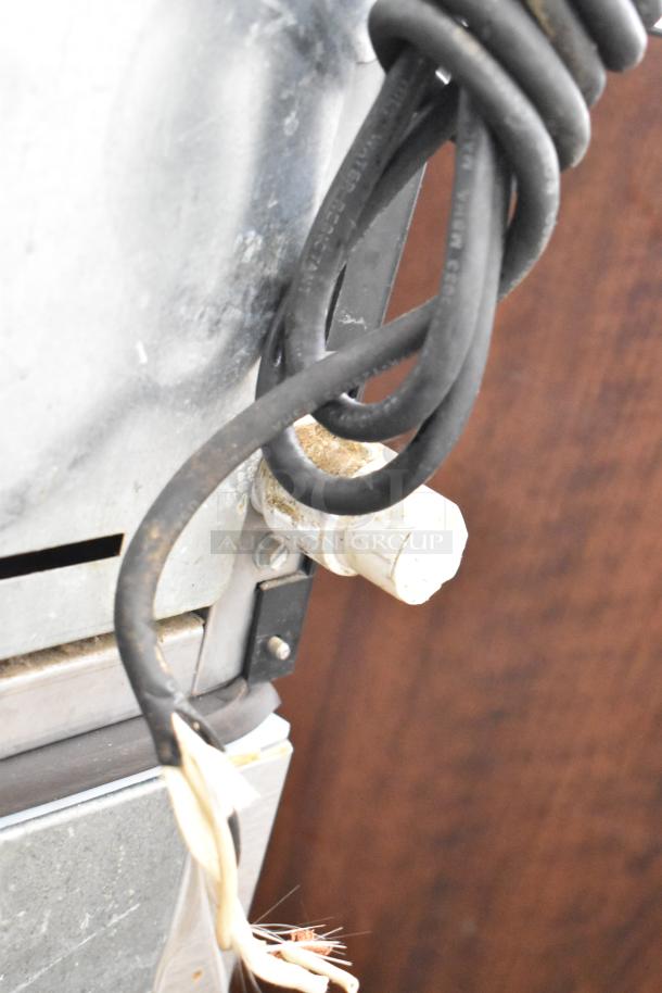 Ice-O-Matic ICE0400FW4 ice head with B40PSB bin, 115V, 1-phase. Visible cords and connectors. Used condition.