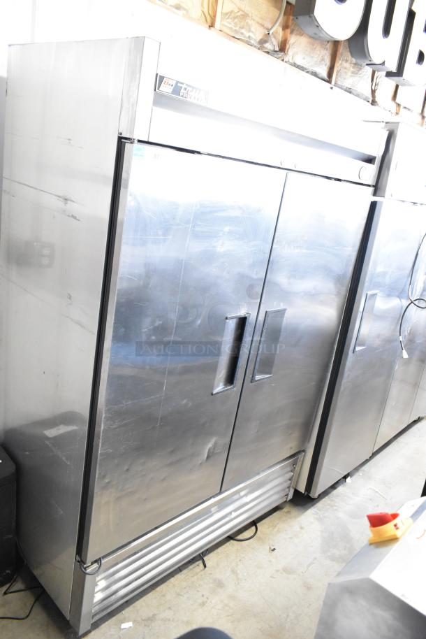 True T-49F Commercial 2 Door Freezer, 115V, 1 Phase, stainless steel, good condition, visible wear.