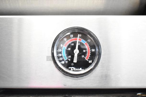 Thermometer gauge on True T-49F freezer showing temperature, highlighting its functionality.