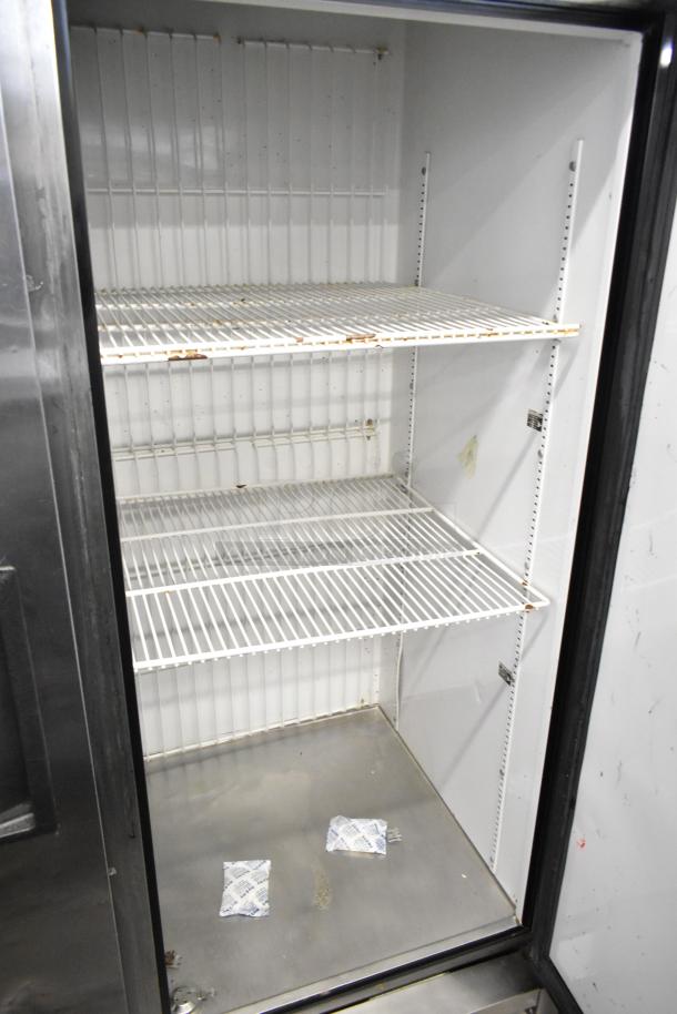 True T-49F Commercial 2 Door Reach In Freezer, 115V, 1 Phase. Features wire shelving, steel interior. Used condition.