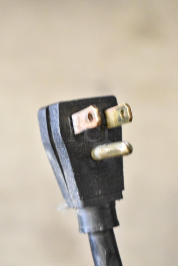 Power plug of True T-49F Commercial Freezer, 115 Volts, 1 Phase. Three-prong detail.