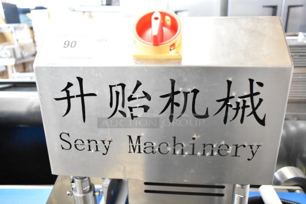 Seny Machinery commercial slicer and conveyor machine, floor style on casters, 220 volts, branded marking shown.