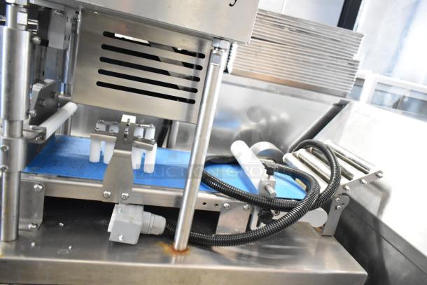 Seny Machinery commercial slicer and conveyor, stainless steel, on casters, 220V. Features durable construction and efficient slicing.