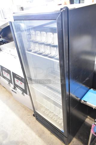 2021 IDW G-12SI-N-3-3-4-B-5 single door cooler merchandiser. 115V, 1 Phase, glass door, shelves visible, good condition.