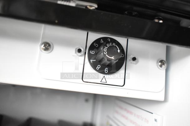 Thermostat dial on 2021 IDW G-12SI-N-3-3-4-B-5 cooler, settings 1-9, "Colder" label. Commercial single-door reach-in cooler.