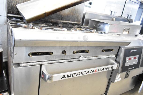 American Range commercial gas-powered 6-burner range with oven, over shelf, and backsplash, used condition.