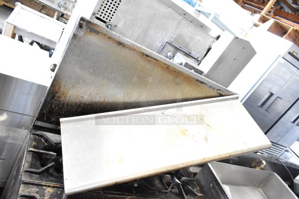 American Range Commercial 6-burner gas stove with oven, over shelf, and backsplash; visible signs of use.