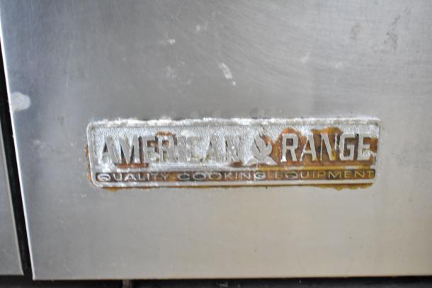 American Range commercial 6-burner gas range with oven and backsplash, showing brand label. In used condition.