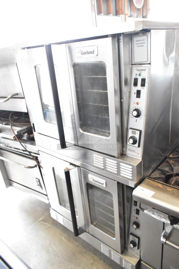 Two 2017 Garland MCO-GS-10S convection ovens, natural gas, view-through doors, thermostatic controls, 60,000 BTU each.