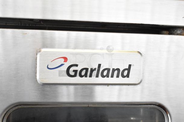 Garland MCO-GS-10S convection oven with logo. Stainless steel, view-through doors, thermostatic controls, 60,000 BTU.