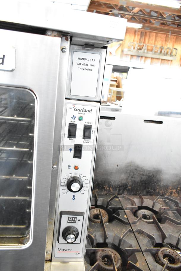 Garland MCO-GS-10S convection oven panel, showing thermostatic controls and manual gas valve label.