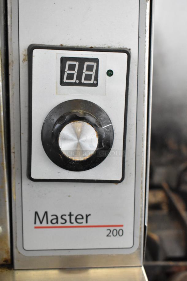 Control panel of Garland MCO-GS-10S convection oven with digital display, large dial, and "Master 200" label.