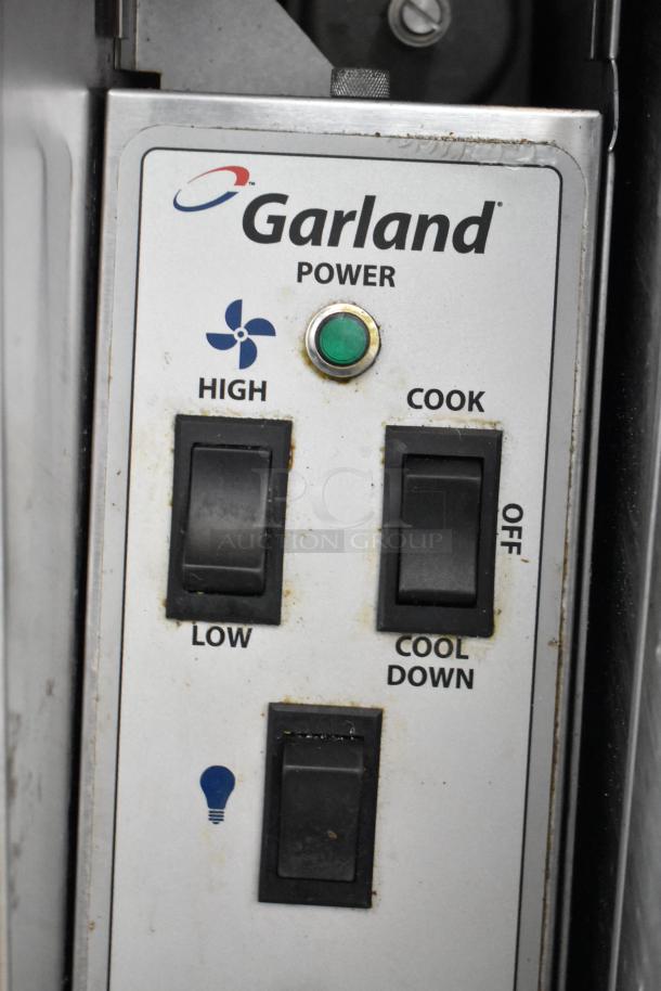 Garland MCO-GS-10S oven control panel with power, fan speed, cook mode, and light switches visible.