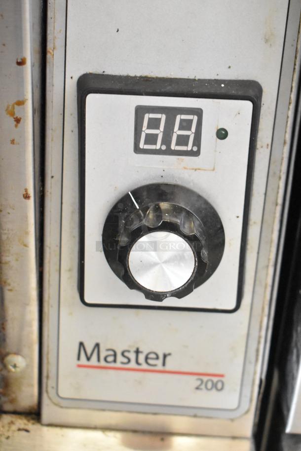 Control panel of Garland MCO-GS-10S Master 200 convection oven with visible knob and digital temperature display.