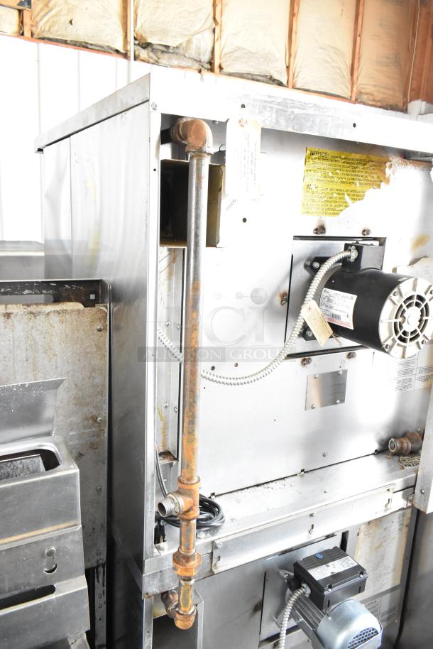 2017 Garland MCO-GS-10S convection oven back view, showing wiring and gas connection. Some rust visible, labels intact.