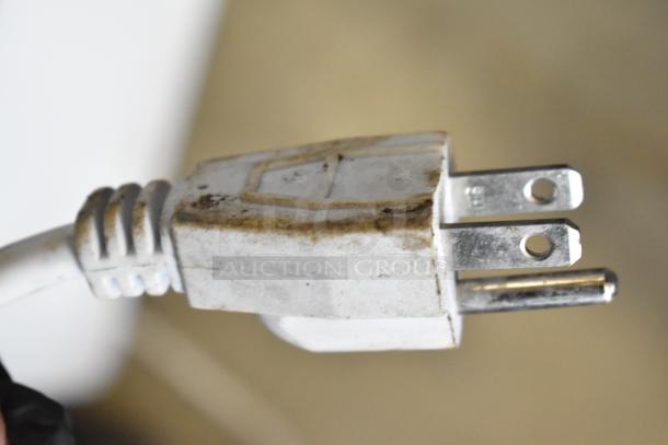 Marchia MDC78W countertop refrigerated merchandiser plug, 110-120 volts. Shows visible wear and dirt.